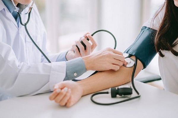 doctor taking blood pressure