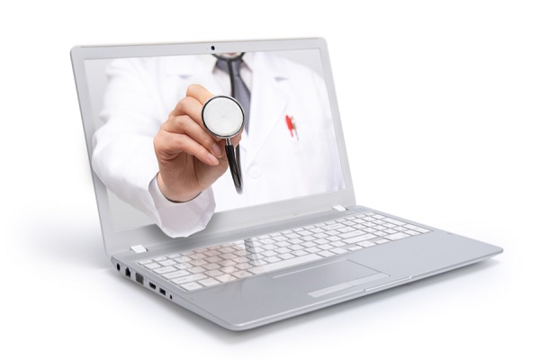 laptop with doctor on screen
